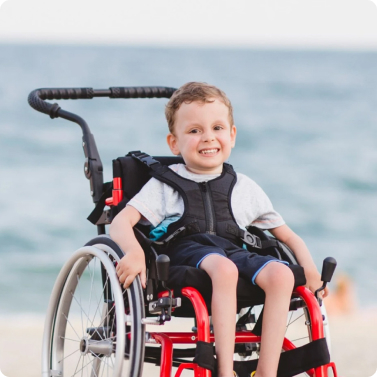 A child in a wheelchair smiling