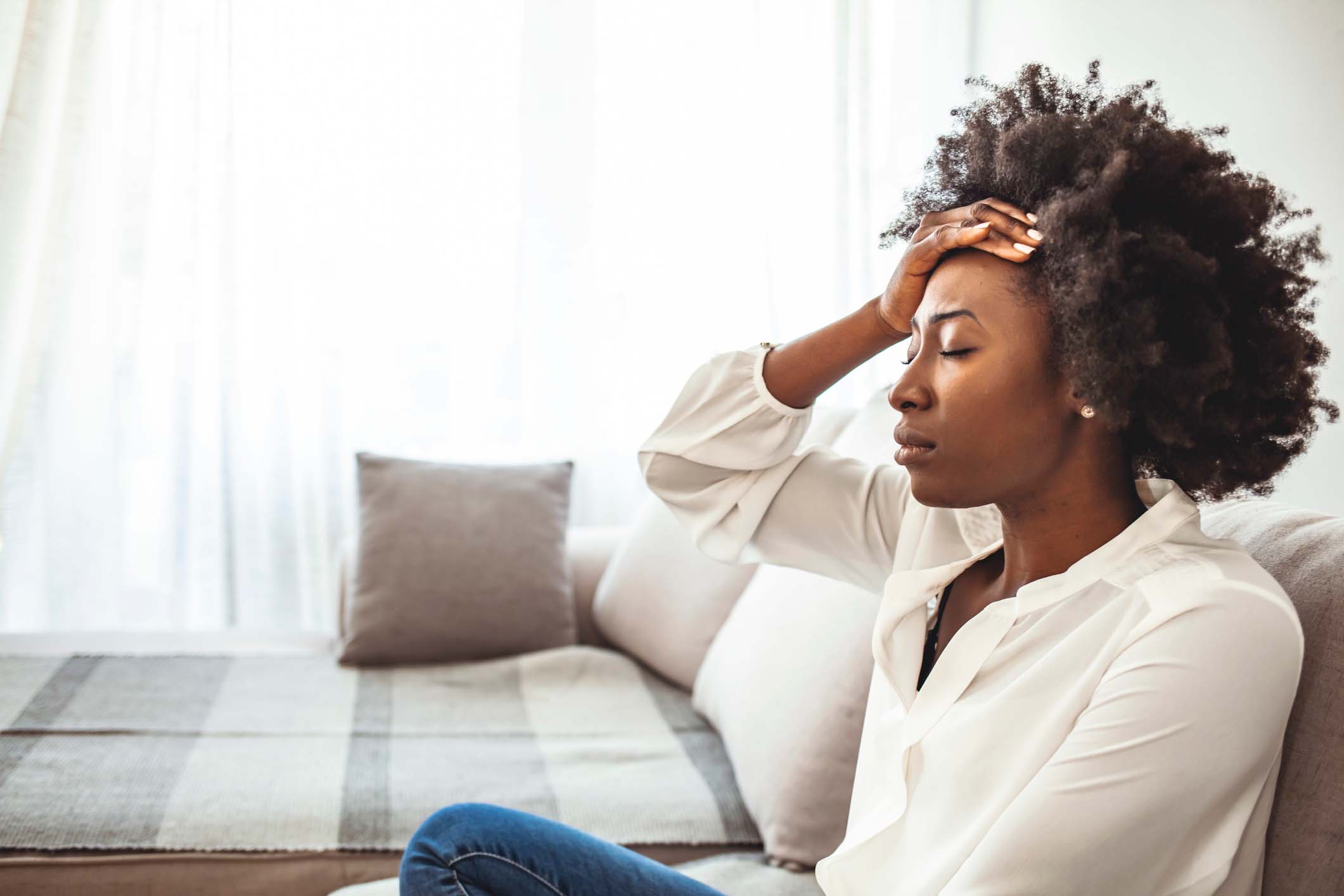 Girl looking stressed out in home